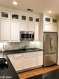 Farmhouse kitchen with painted cabinets sherwin williams pure. The Best Kitchen Cabinet Paint Colors Bella Tucker