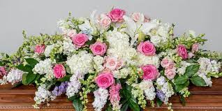 The arrangement of purple carnations and white lilies was. The Definitive Guide To Funeral Flowers Memorials Of Distinction