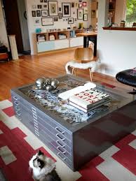 The use of industrial and organic materials makes for an unforgettable statement table. Flat File Storage Blueprint Storage Turned Coffee Table I Ve Been Wanting To Do This Diy Coffee Table Puzzle Table Woodworking Furniture