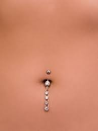 The 14 Worst Bad Taste Beauty Mistakes Allure Magazine Dangly Belly Button Piercings Belly Jewelry Cute Belly Rings Belly Button Piercing Jewelry
