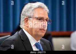 Federal Energy Regulatory Commission Chair Willie Phillips greets Senate  Energy and Natural Resources Committee Chair Joe Manchin (D-W.Va.) before a  hearing