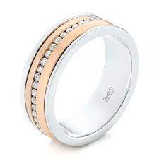 This Men S Ring Features Eternity Channel Set Diamonds Around A Two Tone Band With A Rose Gold Cen Mens Wedding Rings Custom Wedding Rings Black Tungsten Rings
