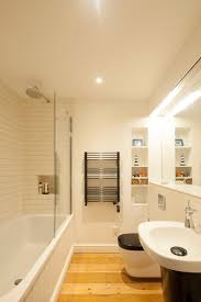 Try a starburst tile design. Pretty Alcove Ideas Interesting With White Bathroom And Wooden Floor