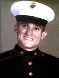 Close Call: Private First Class Sam Hampton is one happy Marine as he  checks an enemy .50 caliber round protruding from his helmet. Hampton was  flying as an aerial gunner with Marine