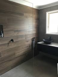 A Perfect Example Of A Modern Industrial Design Bathroom With Matte Black Tapware Modern Bathroom Tile Bathroom Tile Inspiration Black And White Tiles Bathroom