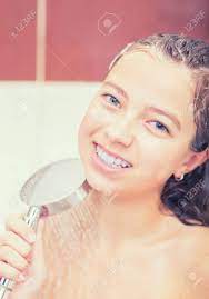 Teenage Girl In Bathroom Is Showering. Morning And Evening Hygiene. Stock  Photo, Picture and Royalty Free Image. Image 91095277.