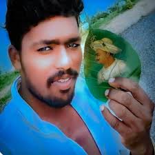 A close-up, high-quality portrait of a stylish Indian young man. He has  well-styled, voluminous dark hair . He is wearing a pastel lavender  crewneck sweater with the name 'Giriraj'embroidered in purple. He