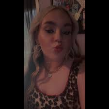 What shirt is Courtney wearing under her t-shirt?