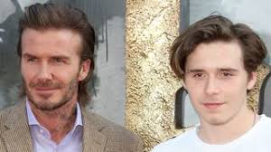 David e Brooklyn Beckham sul red carpet di King Arthur