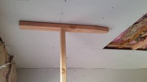 The challenge with hanging ceilings, is moving the drywall into place. Drywall 101 1 Man Hanging Sheets On The Ceiling Youtube