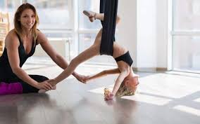 Aerial yoga is a hybrid type of yoga developed by michelle dortignac in 2006 combining traditional yoga poses, pilates, and dance with the use of a hammock. 11 Essential Aerial Yoga Poses To Learn Today Aerial Yoga Zone