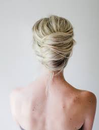 Pin up a loose bun and sweeping the sides up. Messy French Twist Tutorial Once Wed
