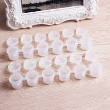 Paint any plastic plant pots you have lying around with spray paint to update your garden without spending a fortune. Mini Empty Plastic Paint Pot Strip