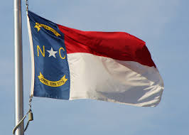 A flag of the united states of america or the state of north carolina that is displayed by a state institution or a political subdivision of the state on the premises of a building of a state institution or a political subdivision of the state shall be handled, displayed, stored, and respectfully disposed of in accordance with the federal flag code, 4 Sliding Away From Democracy In North Carolina Facing South