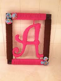 Baby Shower Gift I Made For Baby Ayla Yarn Wrapped Frame And Wooden Letter Flowers Made From Pretty Scrap Mat Wooden Letters Pinterest Projects Frame Wreath