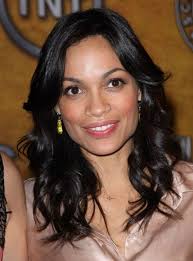 Rosario Dawson wearing her hair down and past her shoulders