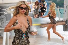 Brooks Nader’s breast pops out of VERY low-cut dress in wardrobe malfunction