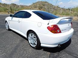 Image result for Triton Green 2004 Tiburon