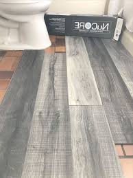 Vinyl Plank Flooring That S Waterproof Lays Right On Top Of Your Existing Floor Love This Color We Re Using In Our Bathroom Re In 2020 New Homes Home Home Remodeling