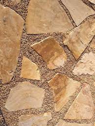Pebbles Placed Between Larger Sandstone Flagstone And Stuck In Place Using A Stone Sealer Easy Diy With A Great Result Flagstone Pavers Flagstone Stones Diy