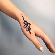 Small Snake Black Work Tattoo On The Hand Small Hand Tattoos Small Snake Tattoo Tattoos