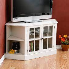 On either side sits a corner shelf for storing media books or decoration in an open display style. Corner Media Cabinet Stand Belezaa Decorations From Creative Corner Media Cabinet Pictures