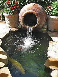 Pond pots, sometimes referred to as still pots, nestle nicely in small spaces such as balconies or decks but they can also be tucked into nooks and crannies in spacious gardens. Pond Society Tour Continued Part 3 Waterfalls Backyard Garden Pond Design Ponds For Small Gardens