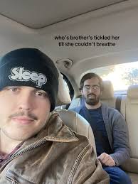 Older Brother Tickles Younger Sister