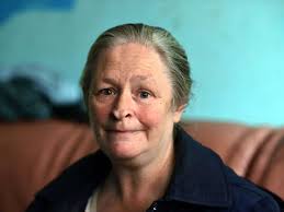 Seriously ill woman lives by candlelight with no power or heating after her  benefits were axed