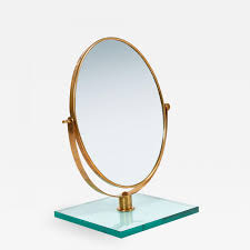 From various styles and designs of specially crafted wooden dressing tables for bedroom, choose the style that gives your room a marvelous look. Italian 1950s Brass Table Mirror On Glass Stand In The Style Of Gio Ponti