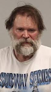 Police: Man charged with stalking neighbor