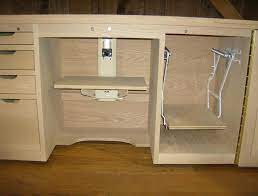 A sewing desk is a necessity for any woman that loves creating beautiful things. Sewing Machine Cabinet Serger Lift Stored Sewing Machine Cabinet Small Sewing Rooms Sewing Room Design