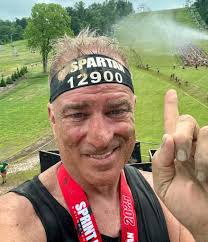 Challenging obstacle course with mud and sand bag carry