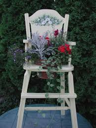 Chair Planter Did This Once With An Old Fashioned Stove Put It In The Kitchen It S Still One Of My Favorit Chair Planter Antique High Chairs Garden Chairs