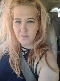 How to return a found photo of Johnny Gilbert to his family in Kenosha, WI?