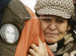 Elizabeth Esquivel holds onto her son Nicholas Garza as he speaks to the  media outside Orange County Courthouse in Goshen about the Laura Garza case 