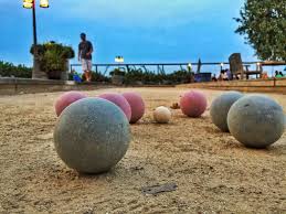 One is the more massive ball, and the other is the smaller one. Can You Play Bocce Ball On Beach Grass Concrete Indoors Backyard Sidekick