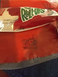 It's from a fruit roll up.it clearly says that in the title. These Fruit Roll Ups Have Tongue Tattoos But They Re Printed Normally So They Ll Be Backwards If You Actually Use Them Assholedesign