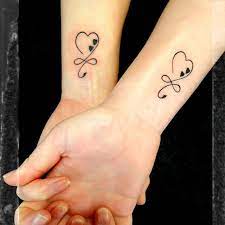 Mother Daughter Heart Tattoos In 2021 Tattoos For Daughters Mother Daughter Tattoos Cute Mother Daughter Tattoos