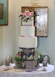 Stylish young groom and bride with wedding bouquet standing together in botanical garden. My Daugthers Spring Garden Wedding Cake Cake By Andrea Cakesdecor