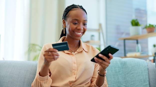 A person holding a card