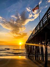 Sunrise flag sunset sky morning landscape nature american flag sea beach. Beach Docks Flag Sunrise Ocean By Krissie Finchum Photo Stock Snapwire