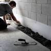 The cost to have a 2 foot deep french drain installed around the exterior of your home, is around $12 per foot when you do it yourself, and up to $32 dollars per foot when hiring a professional to do the work. 1