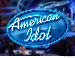 The american idol logo is worn by a worker outside the regent hotel, wall street, where auditions for american idol are being held october 24, 2002 in new york city. American Idol Logo