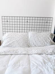 Modern bed headboard ideas create beautiful focal points that enhance bedroom decorating with the collection of 22 modern bed headboard ideas will help to choose the best headboard design for. Diy Grid Headboard Diy Headboard Ideas Covet By Tricia