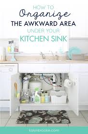 organizing under the kitchen sink in
