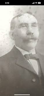 Denis Lane McAuliffe born Mar 24, 1864, son of Jeremiah McAuliffe born  1826. Jeremiah owned Salt and Lime Works at Great Britain Street and  Watercourse Road in Cork. Denis Lane arrived in