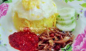 Nasi lemak is a dish that comprises rice made fragrant with coconut cream and pandan leaves. Dari Dapur Aida Nasi Lemak Kuning