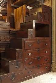 Behind this beautiful asian influenced stairwall, there is a very narrow flight of stairs going down to the garage. Japanese Staircase Chest Asian Home Decor Japanese Tiny House Japanese Furniture