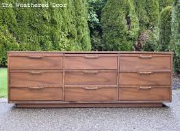 To keep things classic, coordinate the finishes of the natural furniture in the living room. Grey And Natural Walnut Mid Century Dresser The Weathered Door